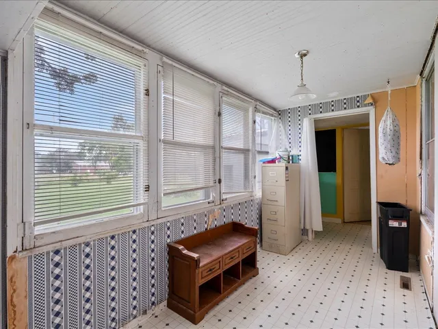 a room that has a bed and a window