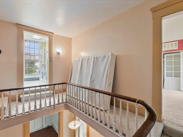 a bathroom with a granite countertop sink a mirror and bathtub