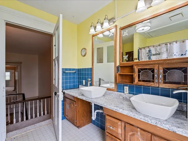 a kitchen with a stove a sink and a cabinets