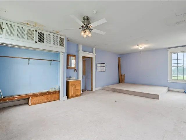 a view of an empty room with a window