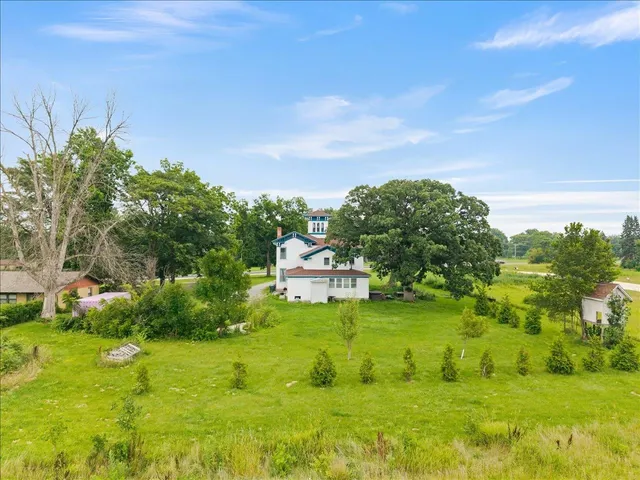 a aerial view of a house with a yard
