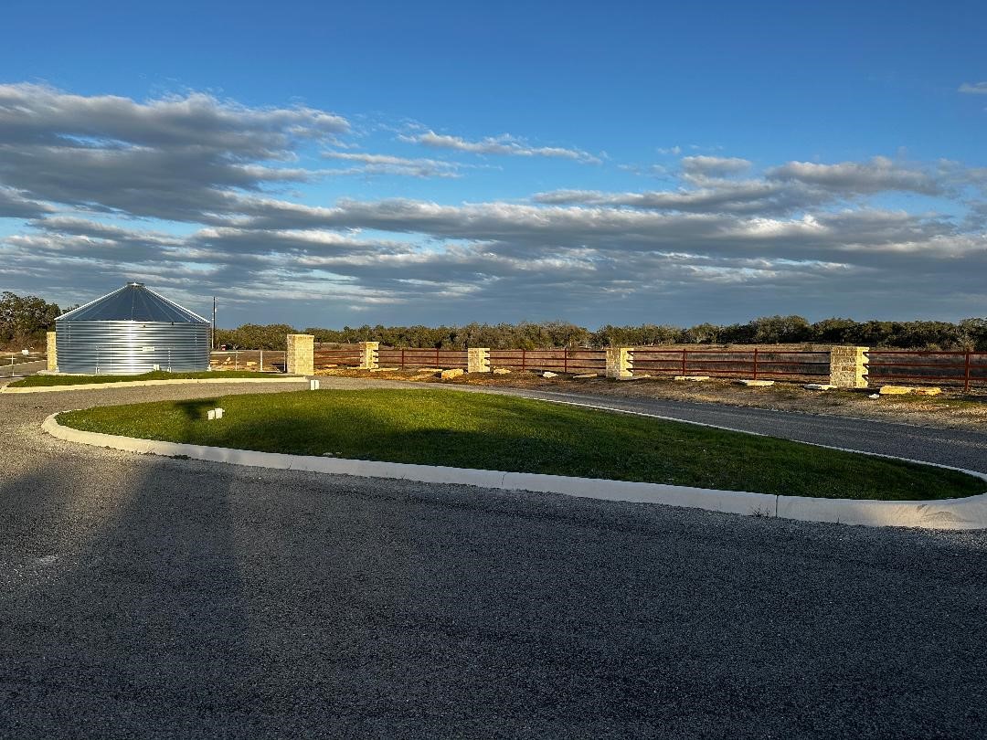 642 Windmill Ridge Drive Blanco, TX 78606 - Photo 9 of 29 a view of a lake with a big yard