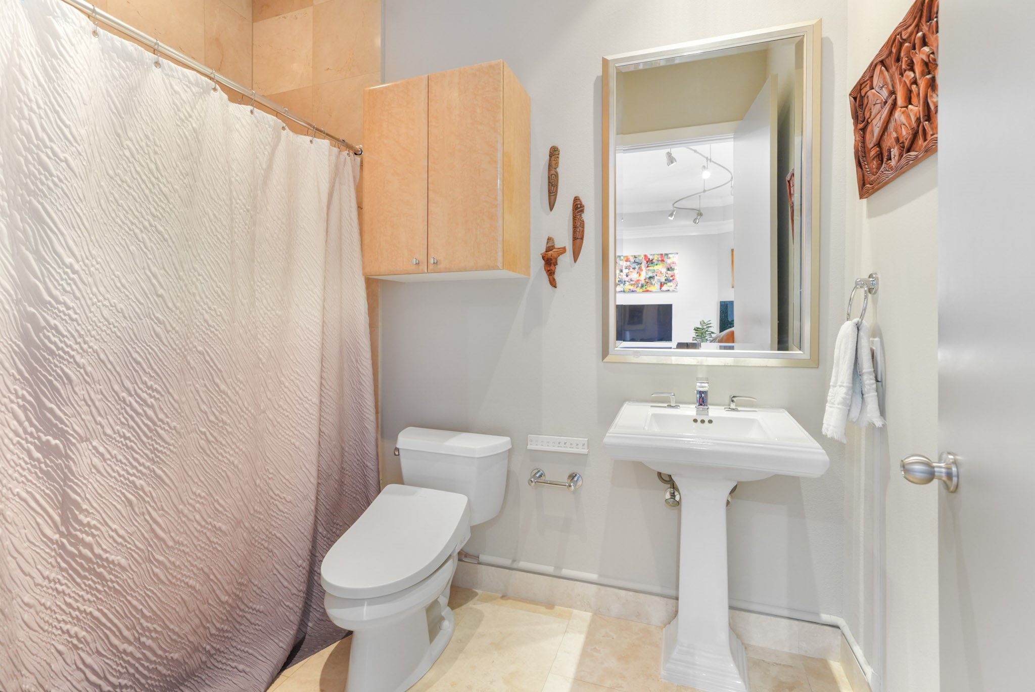 3388 Sage Road, Unit 2102 Houston, TX 77056 - Photo 11 of 21 a white toilet sitting next to a bathroom sink