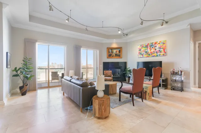 a living room with fireplace furniture and a flat screen tv