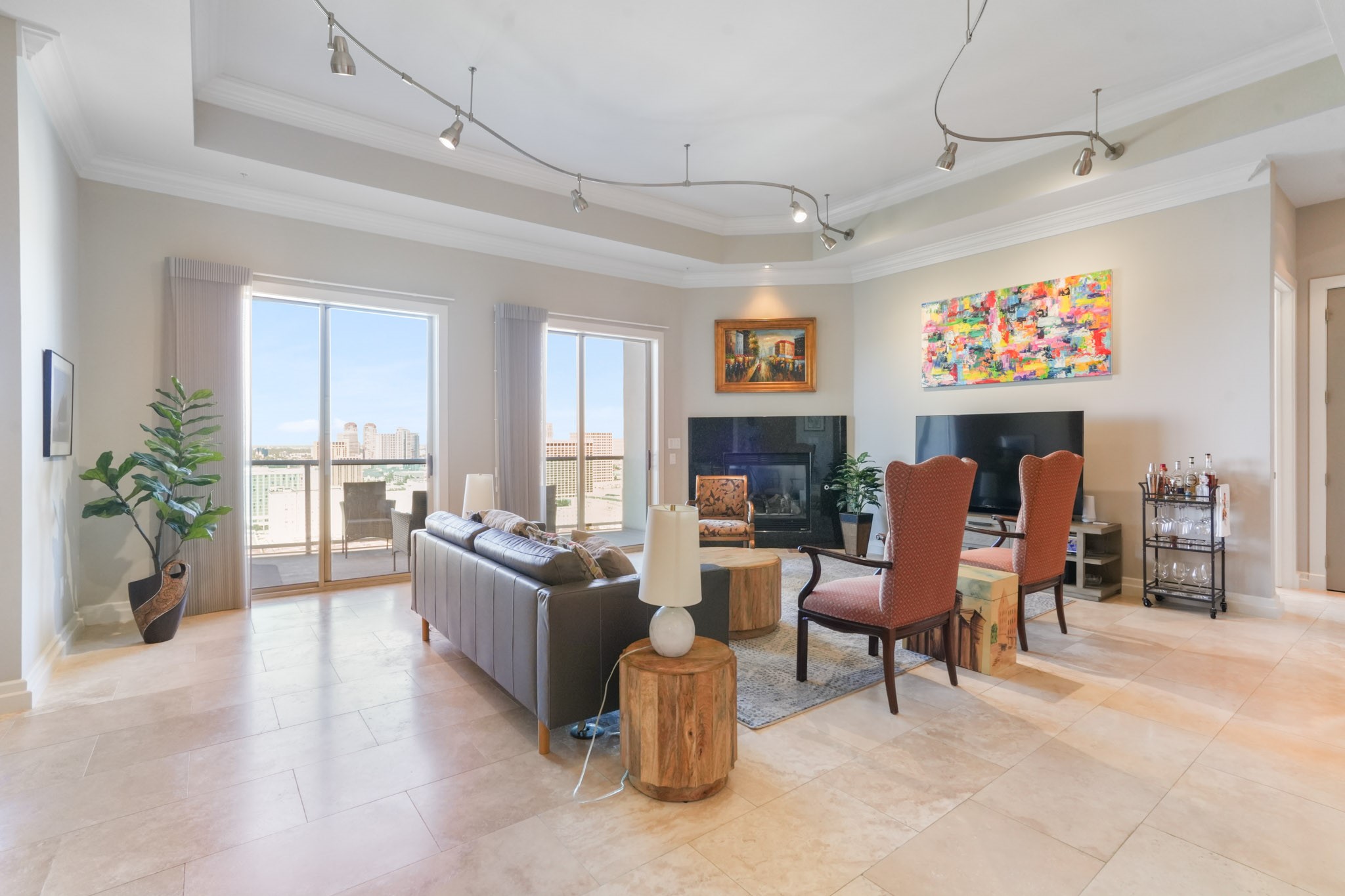 3388 Sage Road, Unit 2102 Houston, TX 77056 - Photo 4 of 21 a living room with fireplace furniture and a flat screen tv