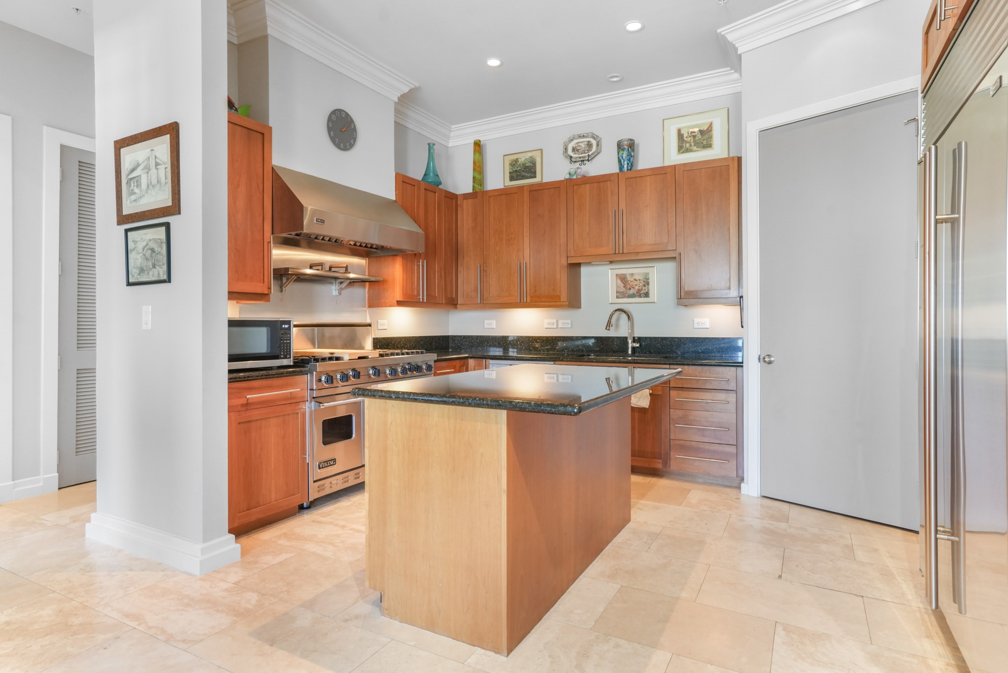 3388 Sage Road, Unit 2102 Houston, TX 77056 - Photo 7 of 21 a kitchen with stainless steel appliances granite countertop a stove a sink and a refrigerator