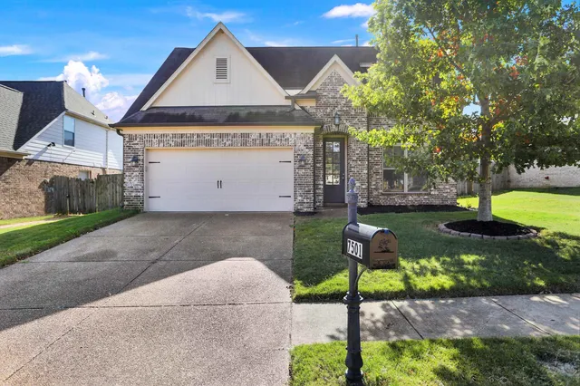 a view of a garden with an outdoor seating