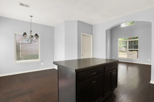 a backyard of a house with barbeque oven