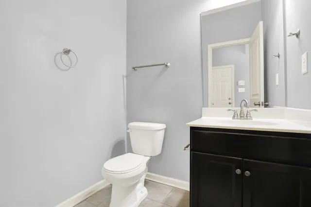 a view of a small space with window and a fan