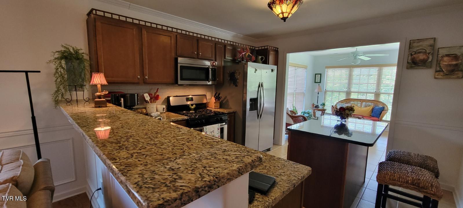 687 Suffolk Road Johnson City, TN 37615 - Photo 6 of 25 Kitchen/ Sunroom from Living