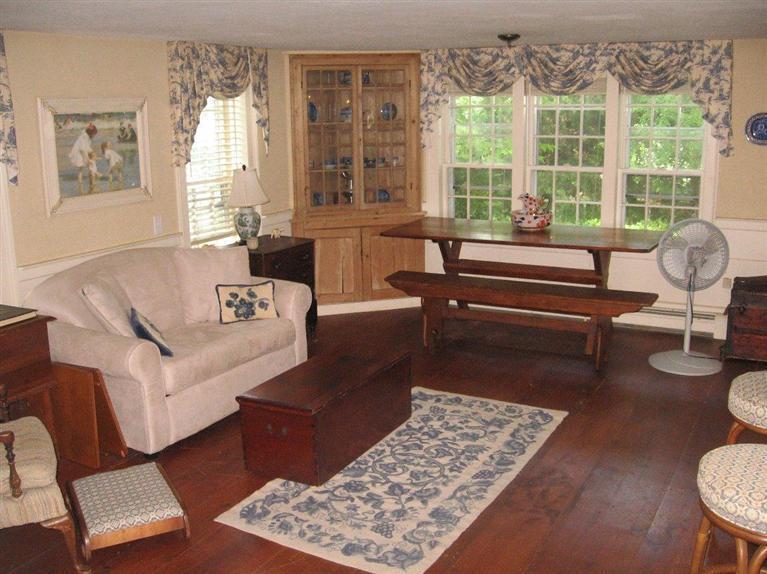 311 Tonset Road Orleans, MA 02653 - Photo 5 of 20 a living room with furniture and a window