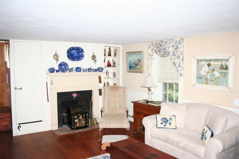 311 Tonset Road Orleans, MA 02653 - Photo 8 of 20 a living room with furniture and a fireplace