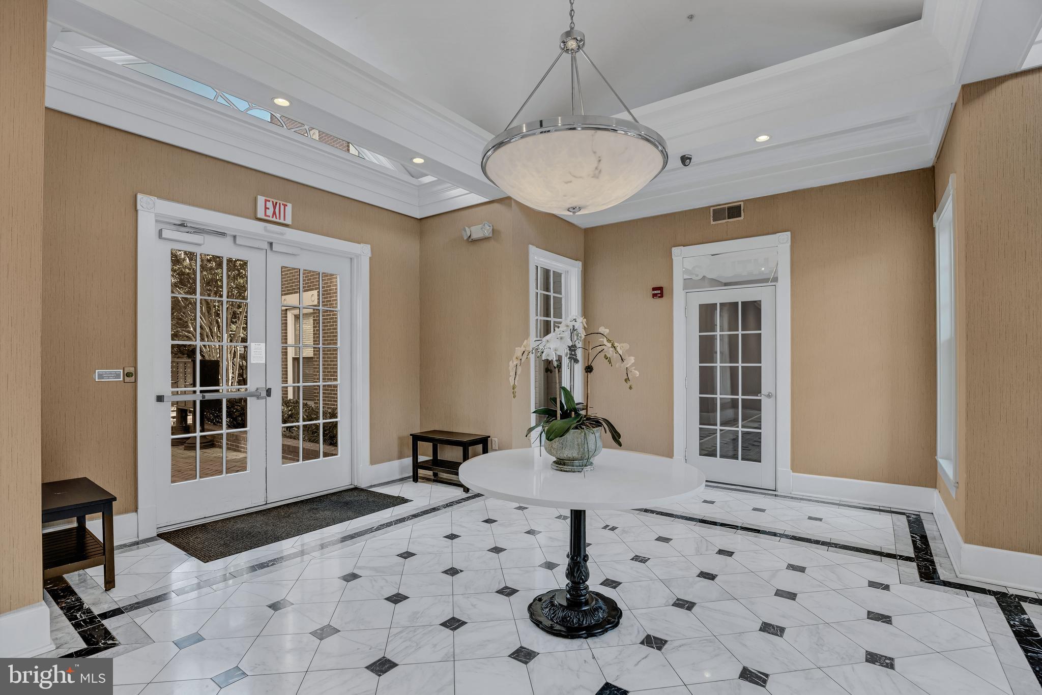 a view of a hallway with a chandelier