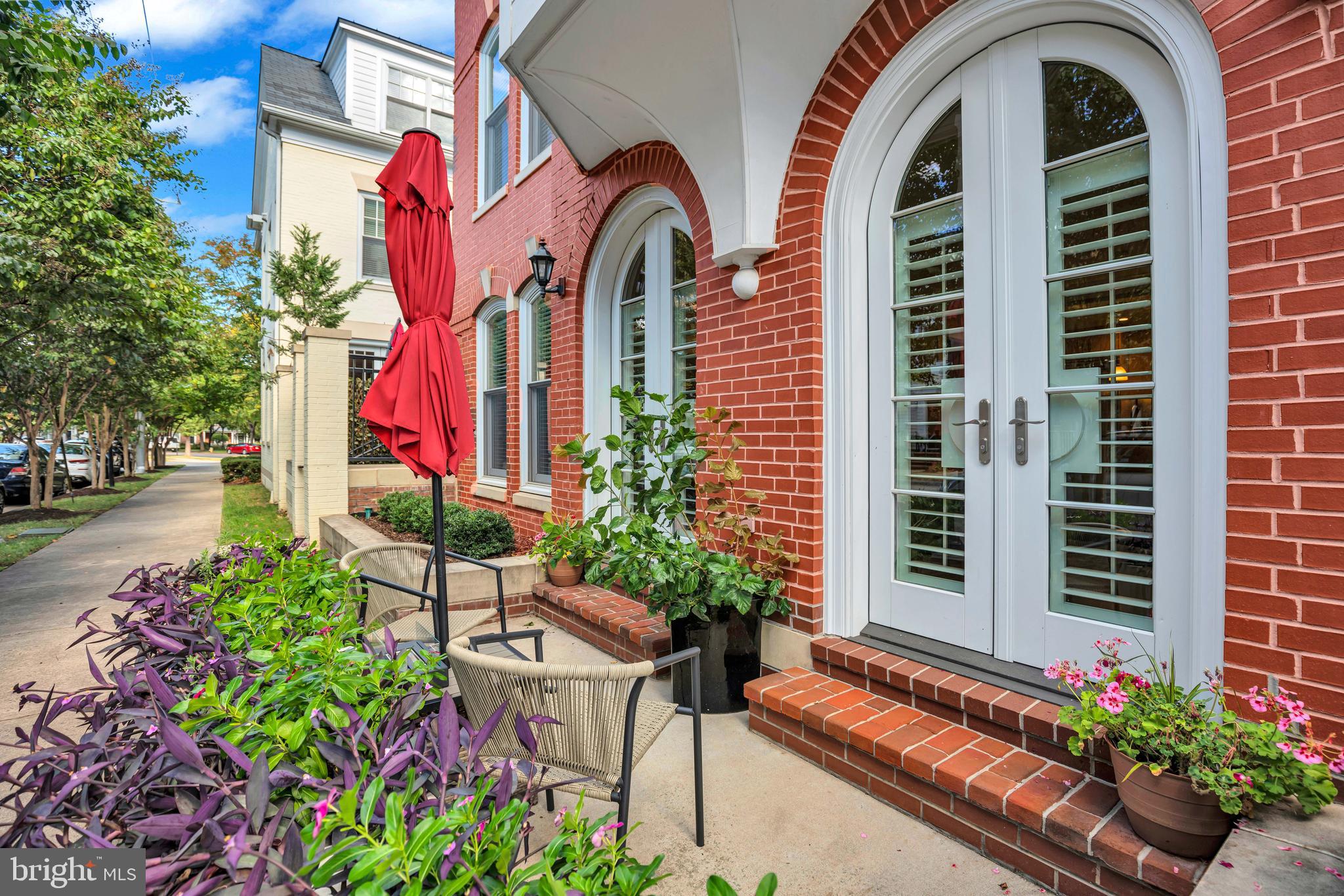 910 Powhatan Street, Unit 104N Alexandria, VA 22314 - Photo 10 of 60 a front view of a house with a garden