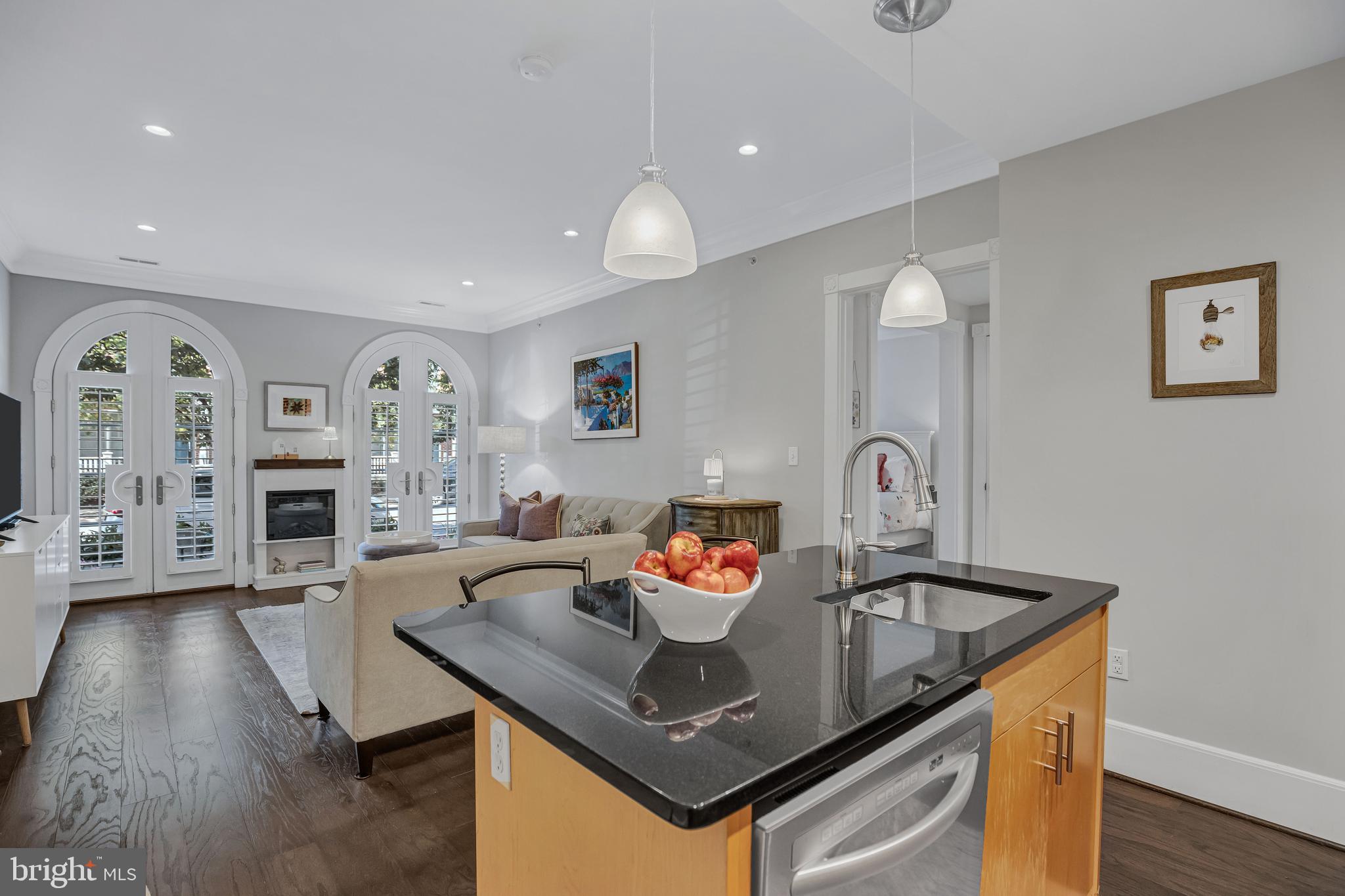 910 Powhatan Street, Unit 104N Alexandria, VA 22314 - Photo 11 of 60 a living room with furniture and wooden floor