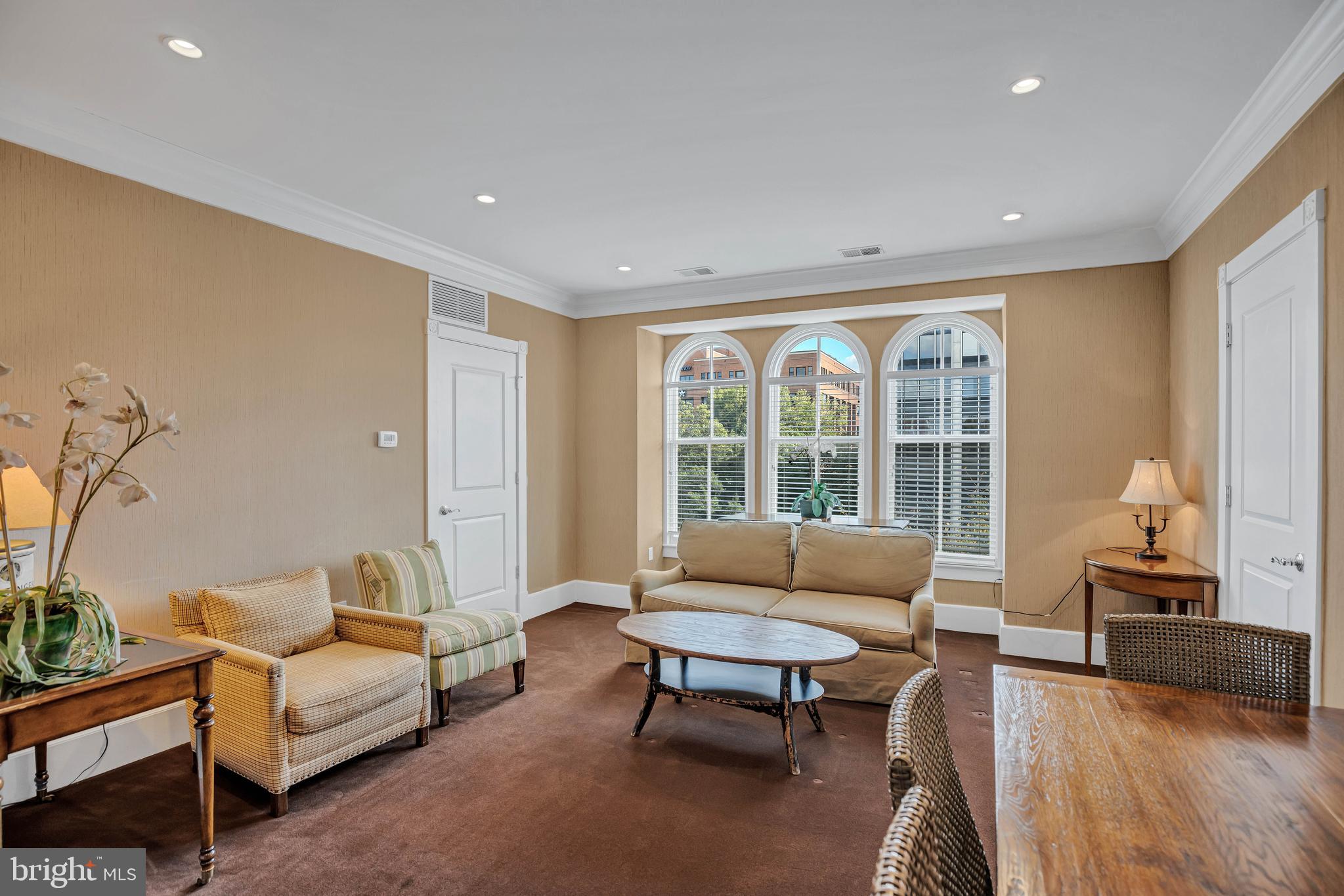 910 Powhatan Street, Unit 104N Alexandria, VA 22314 - Photo 29 of 60 a living room with furniture and a large window