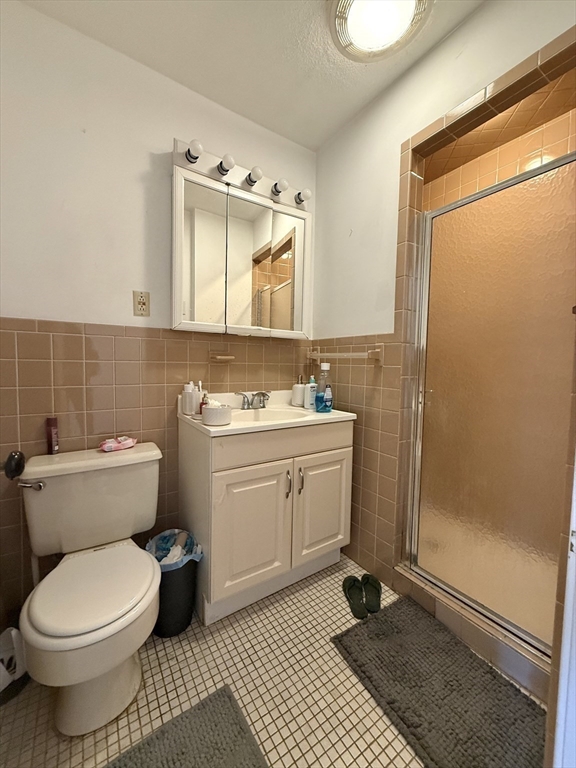 1908 Beacon Street, Unit 2 Brookline, MA 02445 - Photo 13 of 22 a bathroom with a sink toilet and shower