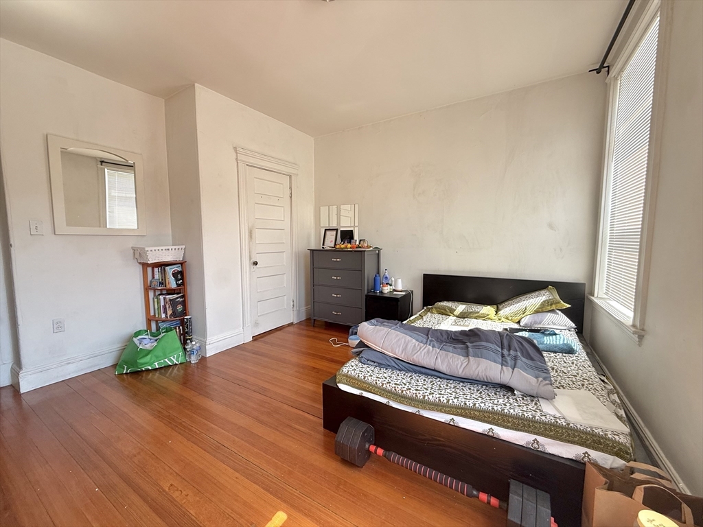 1908 Beacon Street, Unit 2 Brookline, MA 02445 - Photo 15 of 22 a living room with hard wood flooring and a couch