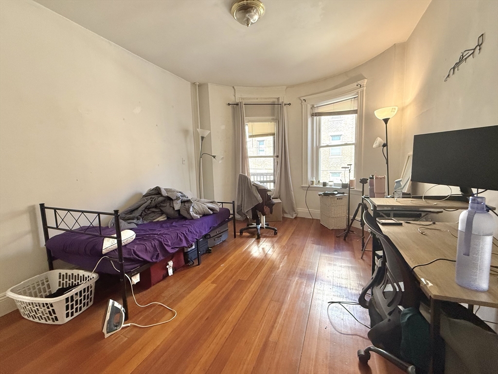 1908 Beacon Street, Unit 2 Brookline, MA 02445 - Photo 16 of 22 a living room with furniture and a flat screen tv
