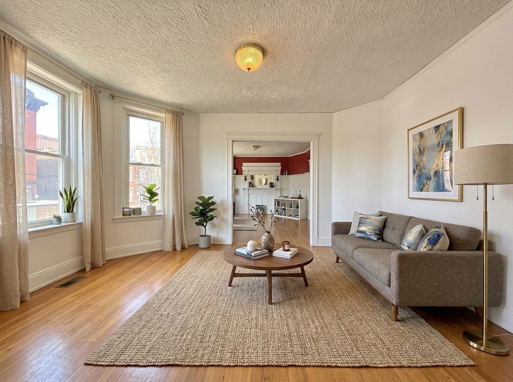 1908 Beacon Street, Unit 2 Brookline, MA 02445 - Photo 20 of 22 a living room with furniture and a rug