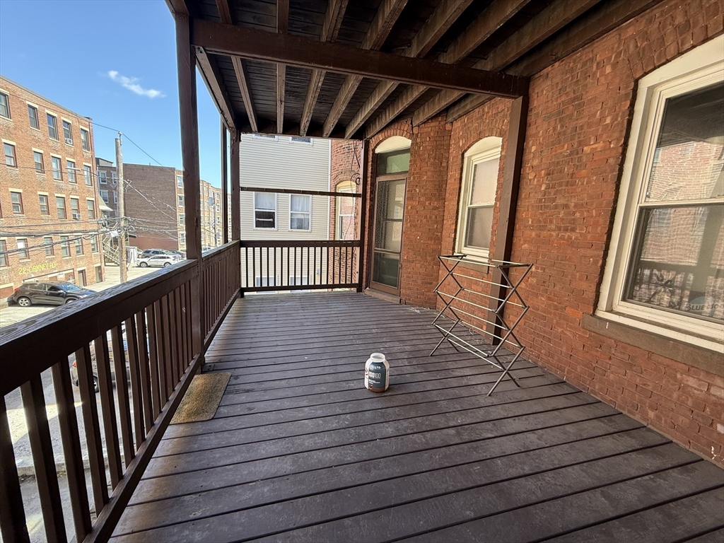 1908 Beacon Street, Unit 2 Brookline, MA 02445 - Photo 22 of 22 a view of a balcony with wooden floor