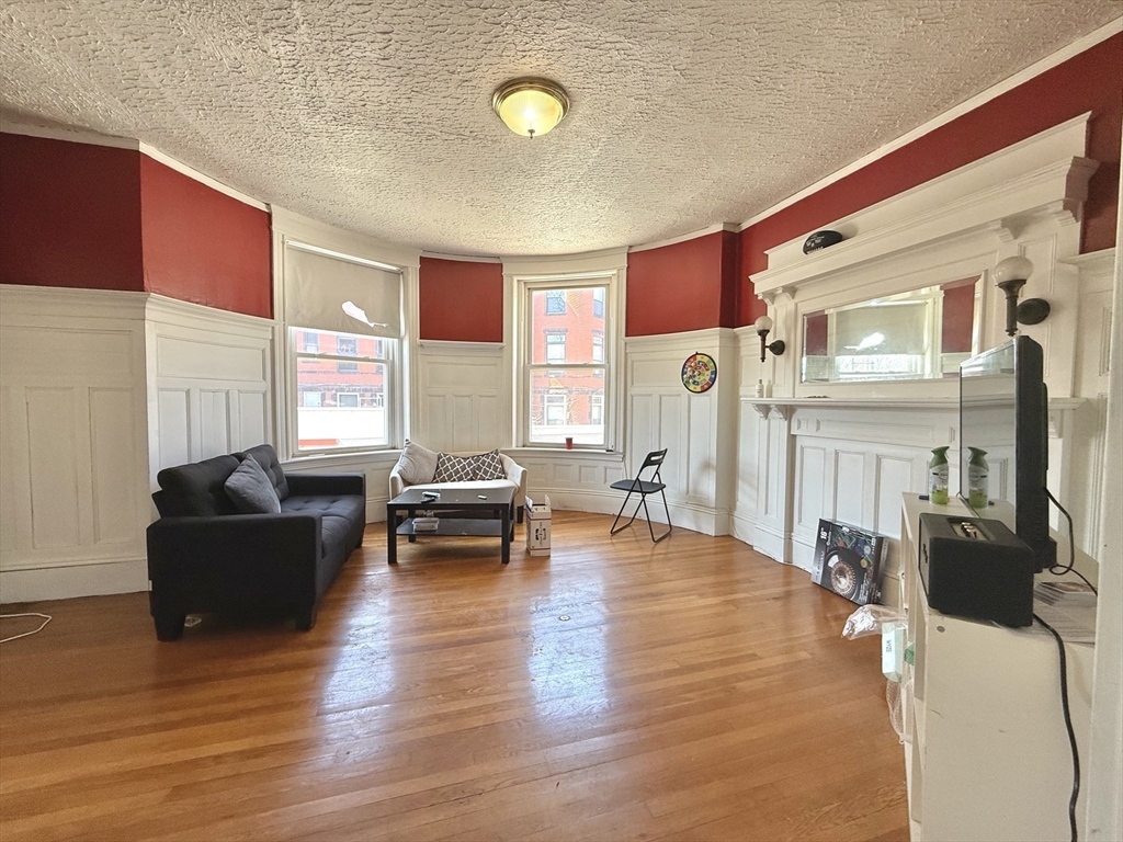 1908 Beacon Street, Unit 2 Brookline, MA 02445 - Photo 3 of 22 a living room with furniture and wooden floor