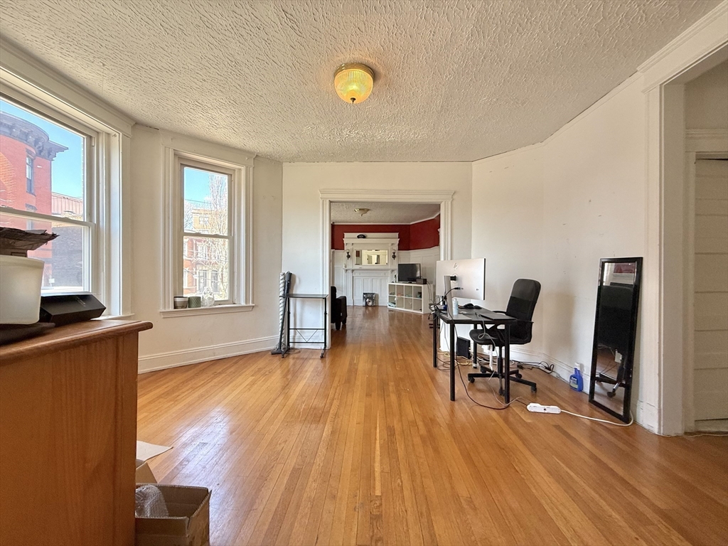 1908 Beacon Street, Unit 2 Brookline, MA 02445 - Photo 4 of 22 a living room with furniture and a wooden floor