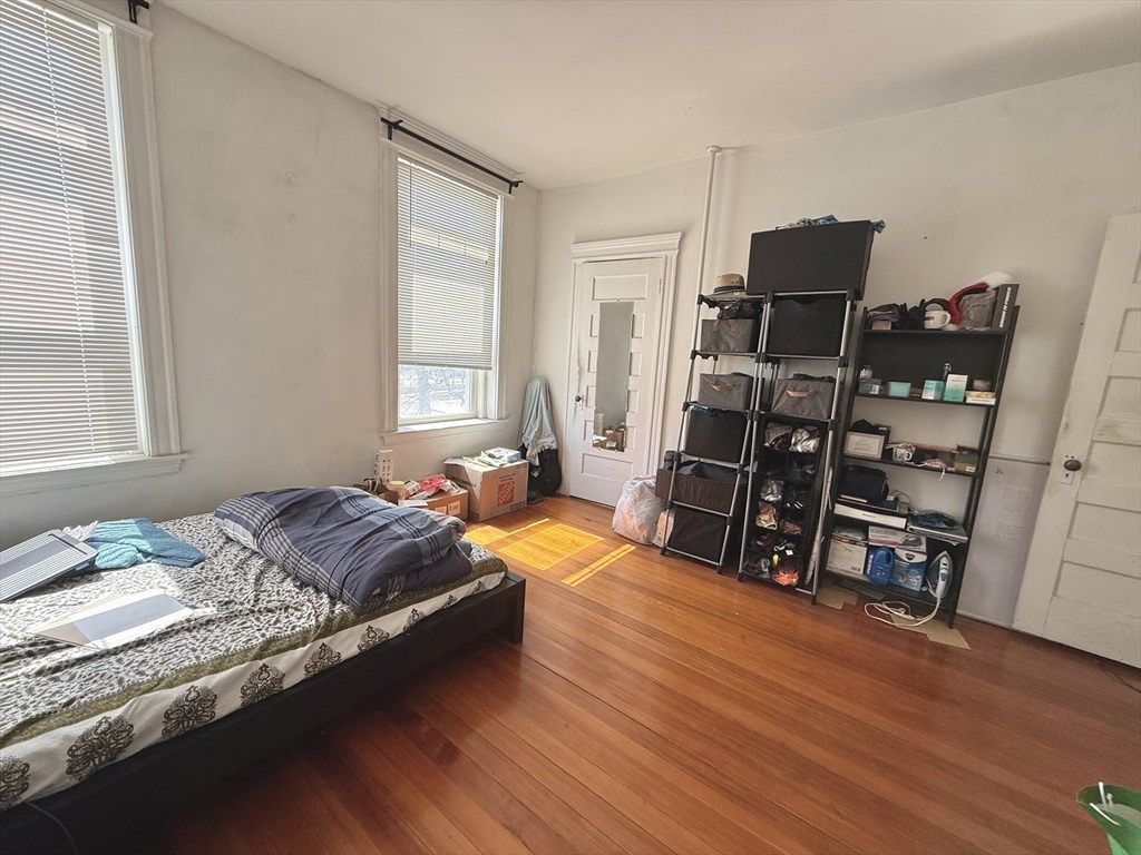 1908 Beacon Street, Unit 2 Brookline, MA 02445 - Photo 10 of 22 a bedroom with a bed and furniture