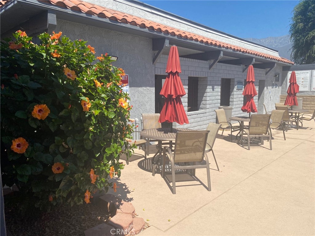 10210 Base Line Road, Unit 51 Alta Loma, CA 91701 - Photo 12 of 19 a view of dinning table and chairs in the patio