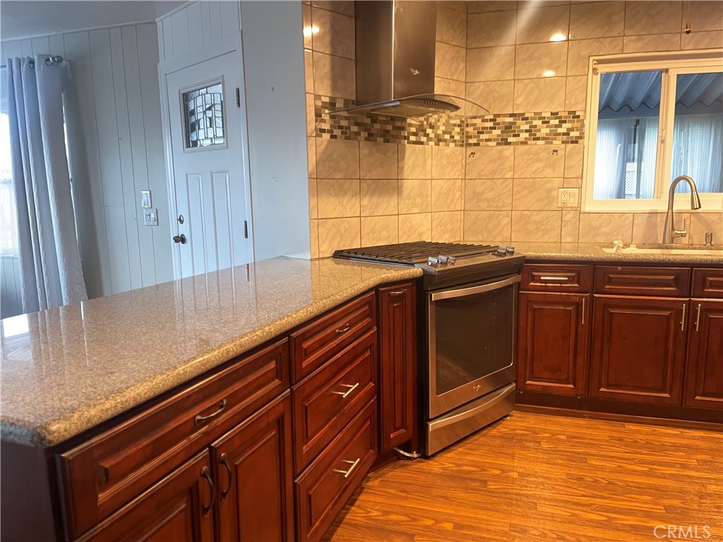 10210 Base Line Road, Unit 51 Alta Loma, CA 91701 - Photo 14 of 19 a kitchen with a sink and cabinets