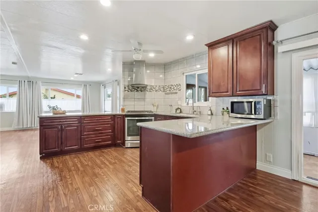 a view of a refrigerator in kitchen and entryway