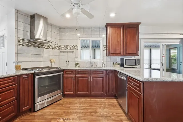 an empty room with a ceiling fan and a window