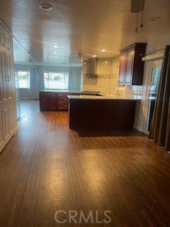 10210 Base Line Road, Unit 51 Alta Loma, CA 91701 - Photo 17 of 19 a view of kitchen and hall with wooden floor