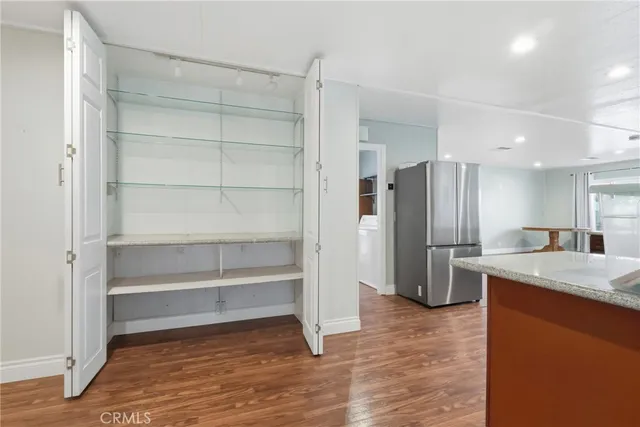 a white toilet sitting next to a shower