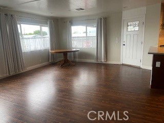 10210 Base Line Road, Unit 51 Alta Loma, CA 91701 - Photo 19 of 19 an empty room with wooden floor and windows