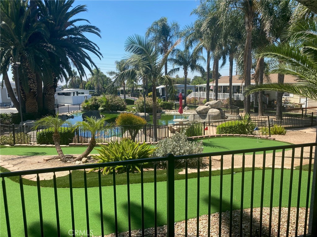 10210 Base Line Road, Unit 51 Alta Loma, CA 91701 - Photo 4 of 19 a front view of multi story residential apartment building with yard and green space