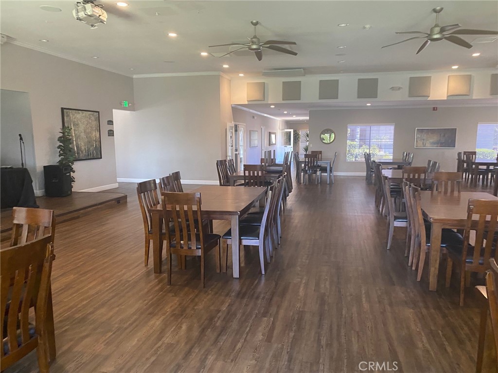 10210 Base Line Road, Unit 51 Alta Loma, CA 91701 - Photo 5 of 19 a view of a dining room with furniture and wooden floor