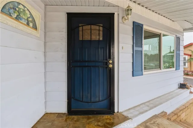 a kitchen with granite countertop a sink and cabinets