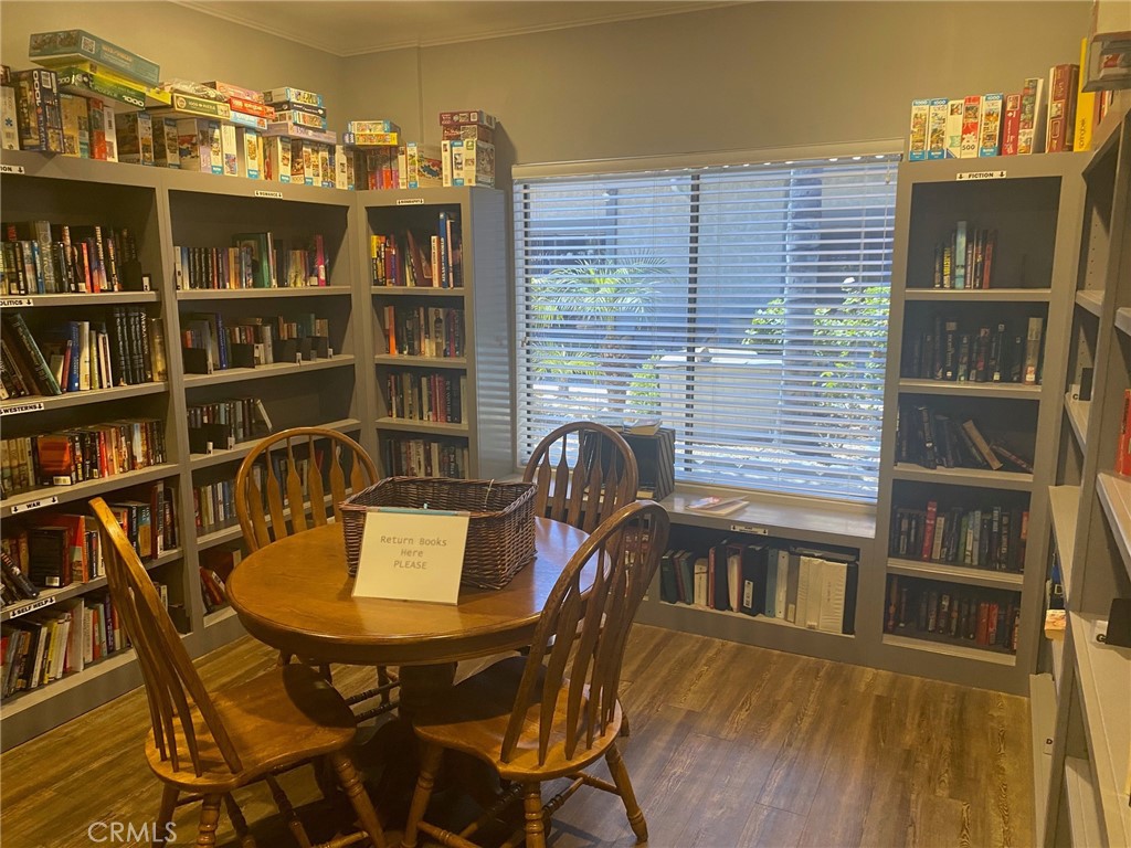10210 Base Line Road, Unit 51 Alta Loma, CA 91701 - Photo 6 of 19 a view of a dining room with furniture and wooden floor
