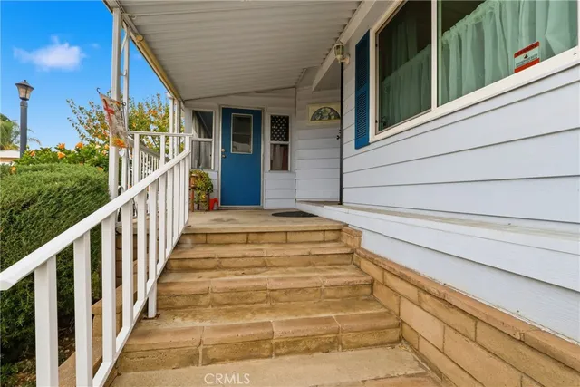 a kitchen with stainless steel appliances kitchen island granite countertop a sink counter space and cabinets