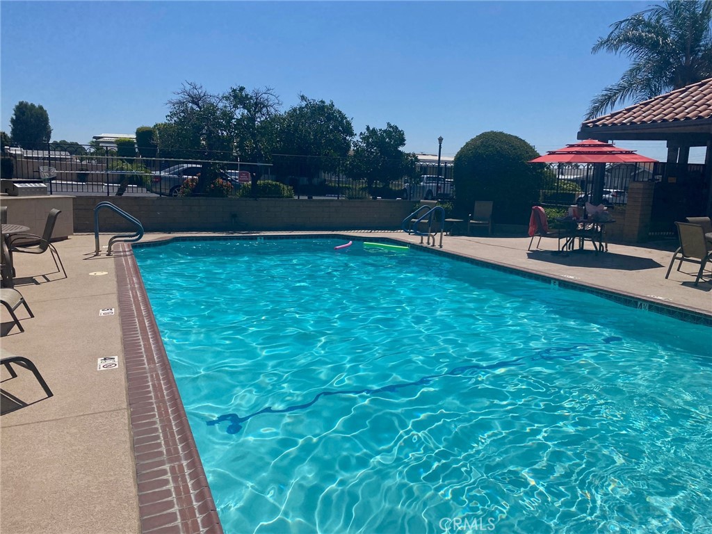 10210 Base Line Road, Unit 51 Alta Loma, CA 91701 - Photo 10 of 19 a view of a backyard with sitting area