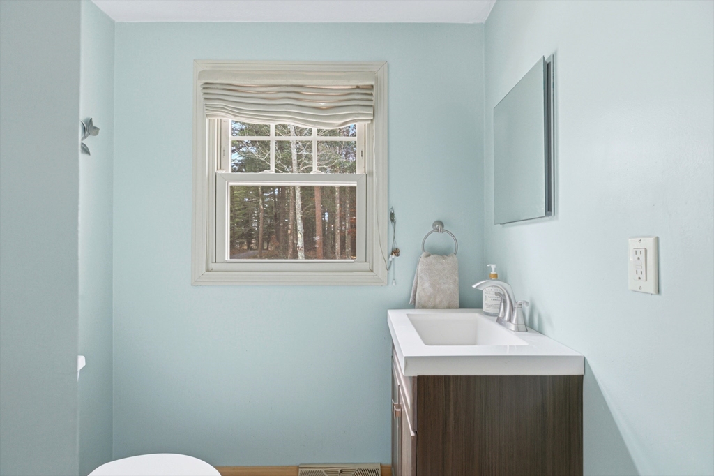 10 Wapping Road Kingston, MA 02364 - Photo 7 of 21 a bathroom with a sink a toilet and a mirror