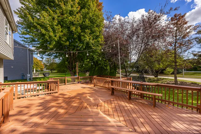 a view of a swimming pool with an outdoor seating and a yard