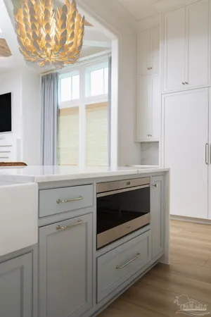 a kitchen with a stove and a window
