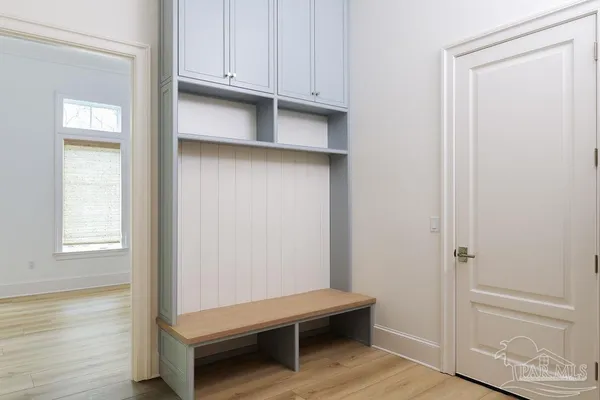 a bedroom with furniture and windows