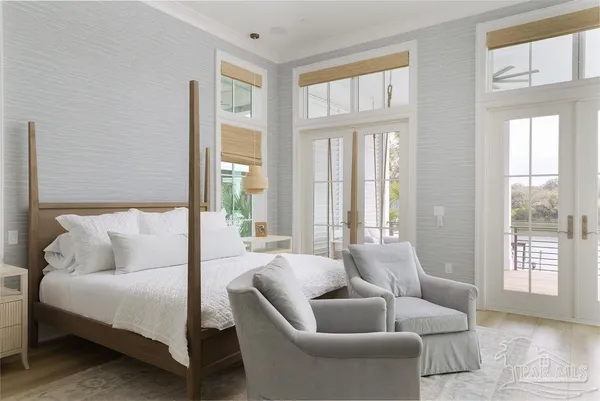 a bedroom with a bed and a lamp
