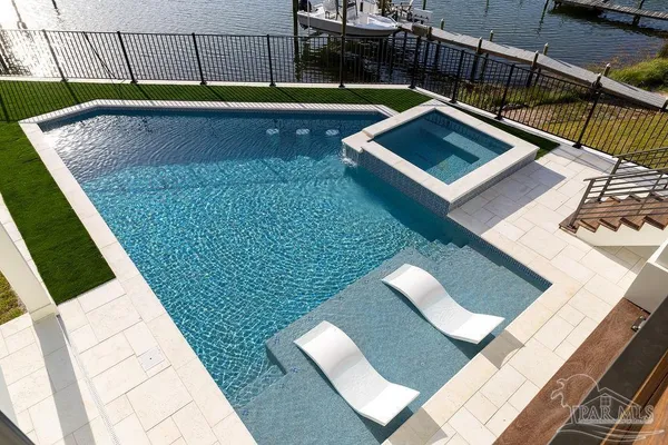 a view of a roof deck with wooden floor and fence