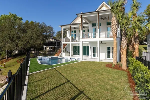 a view of swimming pool with a couches