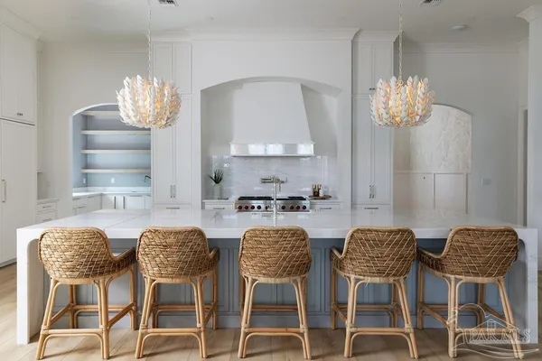 a view of a dining room with furniture and chandelier