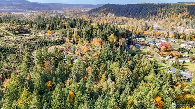 a view of a town with mountains in the background